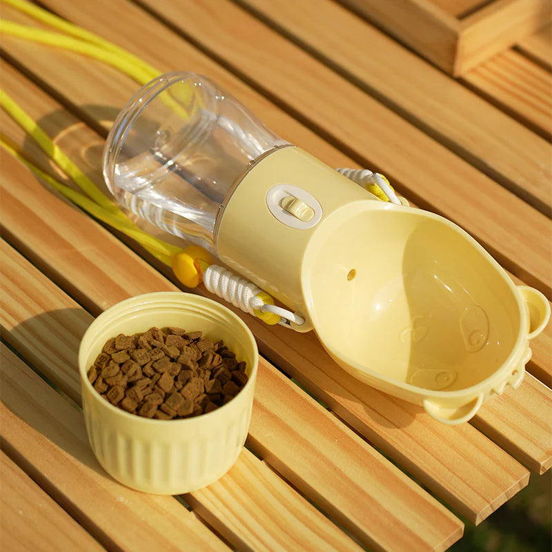Trail Sip bottle in yellow next to a cup of kibble
